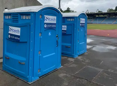 Portable toilet rental units delivered and set up on a professional construction site